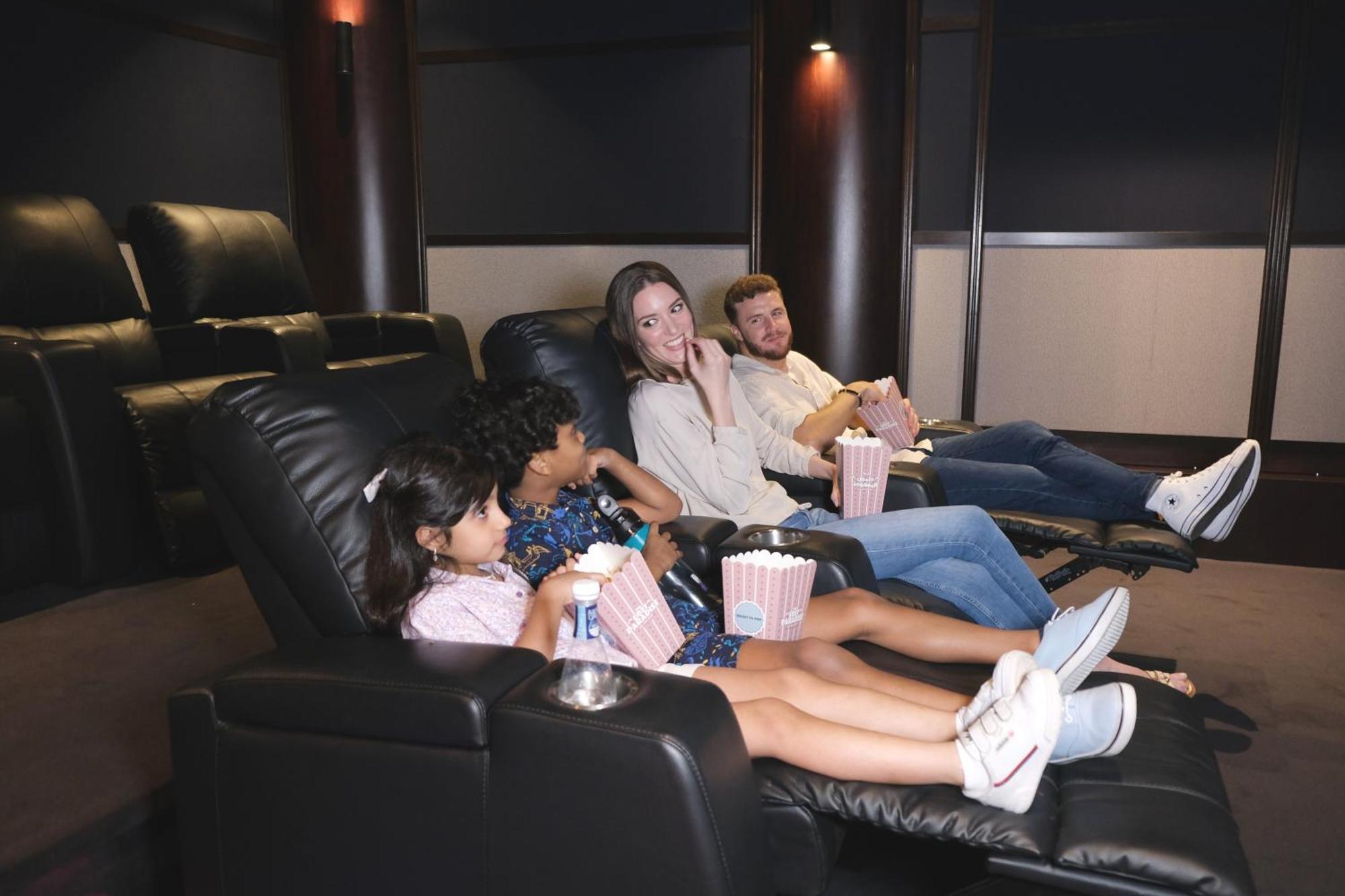 Hotel Charthouse Bahrain Manama Exterior foto A family watching a movie in a home theater